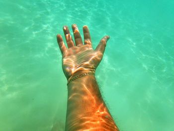 Low section of person in swimming pool