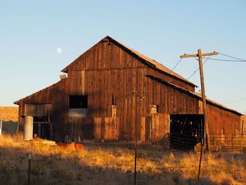 Abandoned barn against clear sky