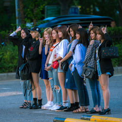 High angle view of people standing in front of traditional clothing