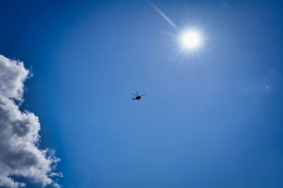 Low angle view of airplane flying in sky