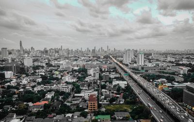 High angle view of buildings in city against sky