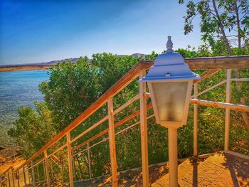 Gazebo by sea against sky