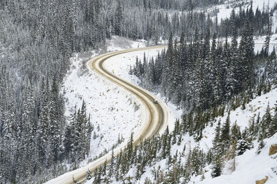 Car traveling on highway through a mountain pass