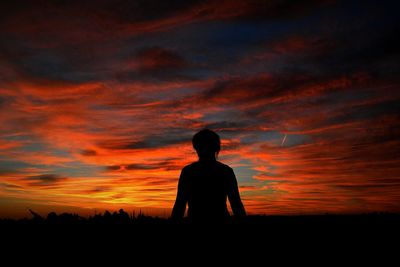 Silhouette of man standing on landscape