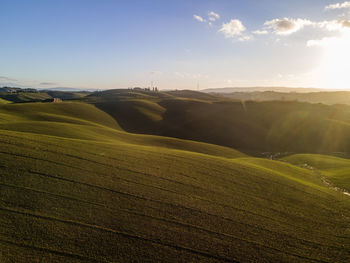 Scenic view of agricultural field against sky