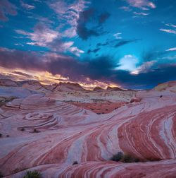 Aerial view of desert against sky at sunset