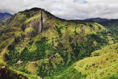 Scenic view of mountains against cloudy sky