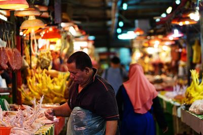 Group of people at market stall