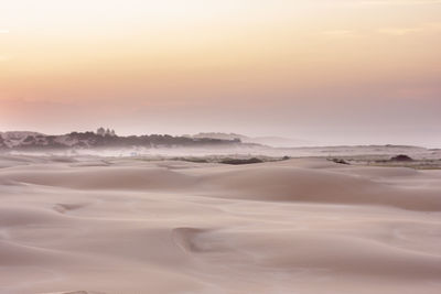 Scenic view of landscape against sky during sunset