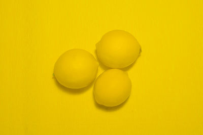 High angle view of eggs in yellow background