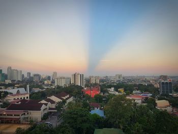 High angle view of buildings against sky during sunset