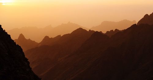 Scenic view of mountains against sky during sunset