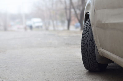 Close-up of car on road