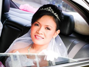 Bride sitting in car