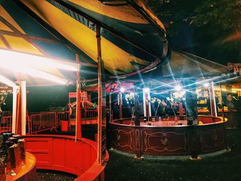 Illuminated train at night