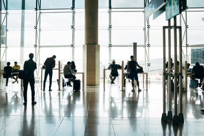 Group of people walking in airport