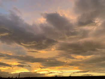 Low angle view of dramatic sky during sunset