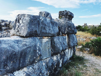 Rock formation on land against sky