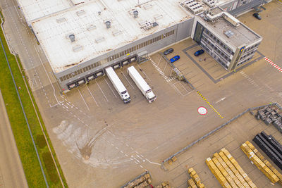 Aerial view of goods warehouse. logistics delivery center in industrial city zone from above. 