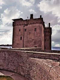 Low angle view of old building against sky