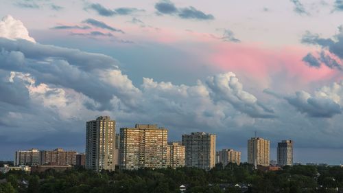 Cityscape against the sky during sunset of brampton from the top of a park hill in ontario, canada