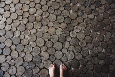 Low section of woman on wooden floor