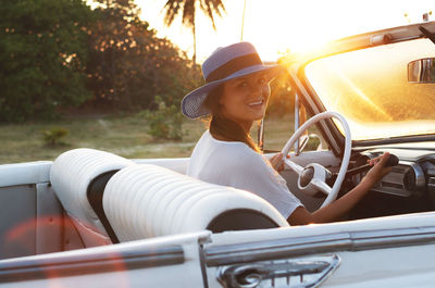 Side view of woman in car