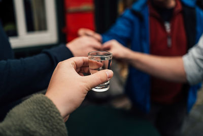 Midsection of woman holding drink