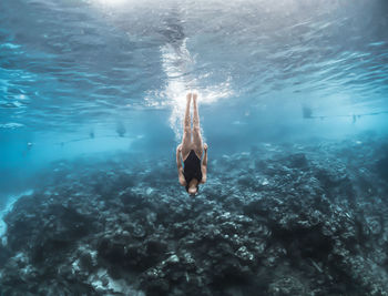 Woman swimming in sea