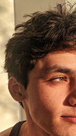 Close-up portrait of young man looking away