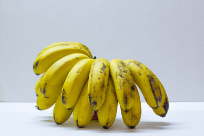 Close-up of bananas against white background