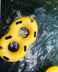 High angle view of yellow floating on water