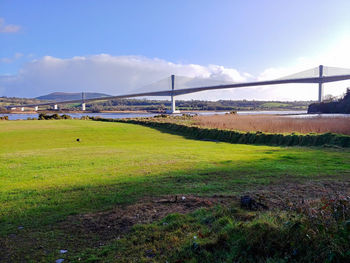 View of bridge on field against sky