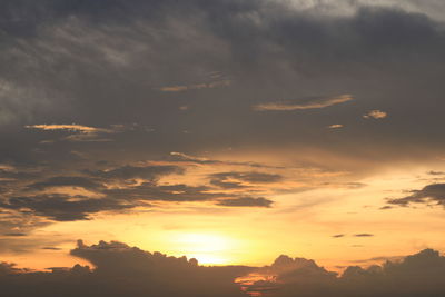 Low angle view of silhouette mountain against dramatic sky