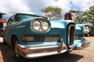 Abandoned vintage car against sky