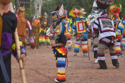 Rear view of woman standing in traditional clothing