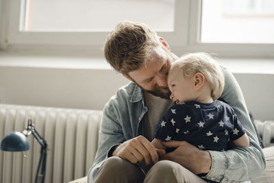 Father spending time with his son at home