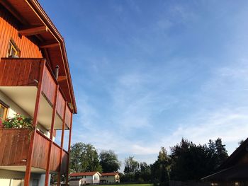 Low angle view of buildings against blue sky