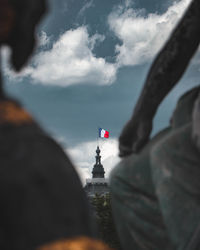 Low angle view of man standing against sky