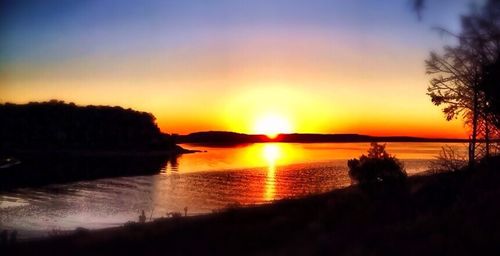 Scenic view of sunset over river