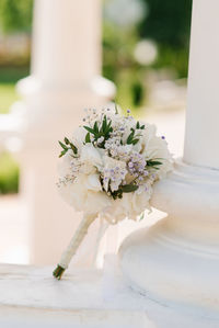 Beautiful bouquet of the bride in white with greenery