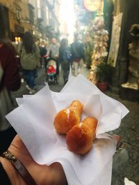 Midsection of person holding ice cream