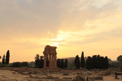 Built structure against sky during sunset