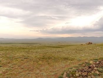 Scenic view of landscape against sky during sunset