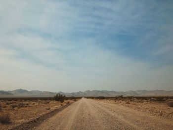 Dirt road passing through a desert