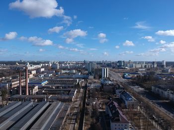 High angle view of buildings in city against sky