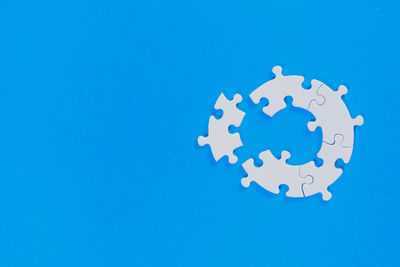 High angle view of clock on blue background