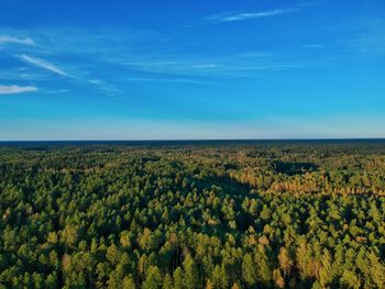 Scenic view of land against blue sky