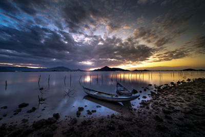 Scenic view of lake against sky during sunset