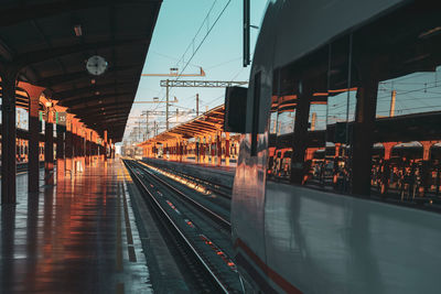 Train at railroad station against sky